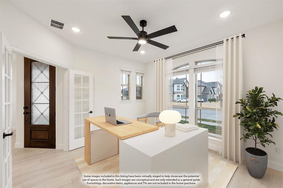 Home office with wood desk, ceiling fan, large windows, and glass-panel front door nearby Home office with wood desk, ceiling fan, large windows, and glass-panel front door nearby