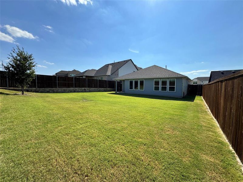 Rear view of property with a fenced backyard Rear view of property with a fenced backyard