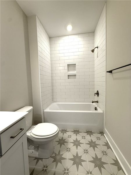 Secondary bathroom features subway tiled bath and Secondary bathroom features subway tiled bath and