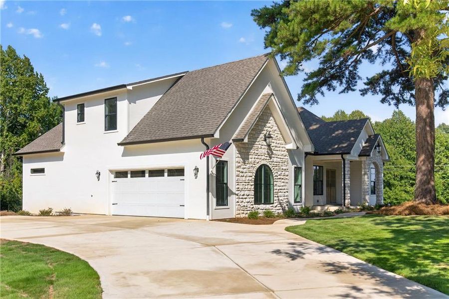 Front exterior of a new home in , Dallas, GA, highlighting curb appeal (Image 2). Front exterior of a new home in , Dallas, GA, highlighting curb appeal (Image 2).