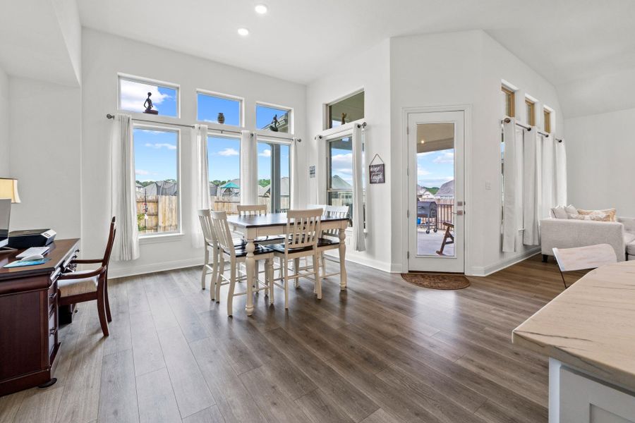 This spacious dining space is large enough for a dining table and a desk, but you could easily fit a buffet or hutch here as well.