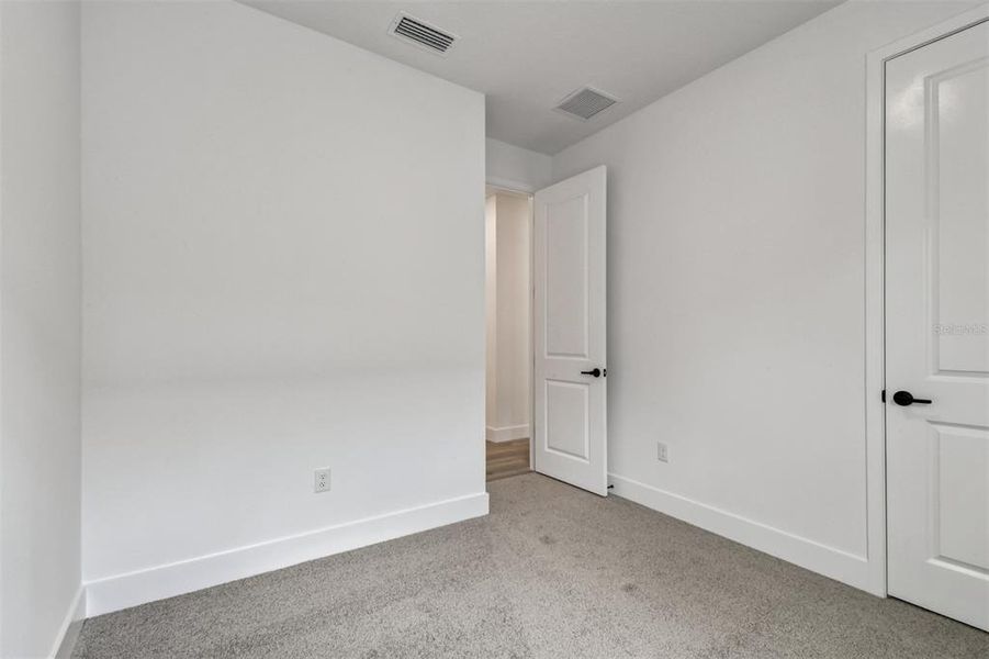 Spacious, unfurnished interior of a new home in The Peninsula at Rhodine Lake, Riverview (Image 24).