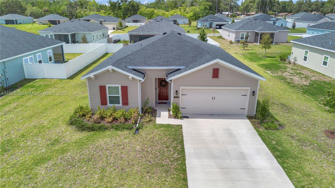 Front exterior of a new home in Country Lane Estates, Williston, FL, highlighting curb appeal (Image 18). Front exterior of a new home in Country Lane Estates, Williston, FL, highlighting curb appeal (Image 18).
