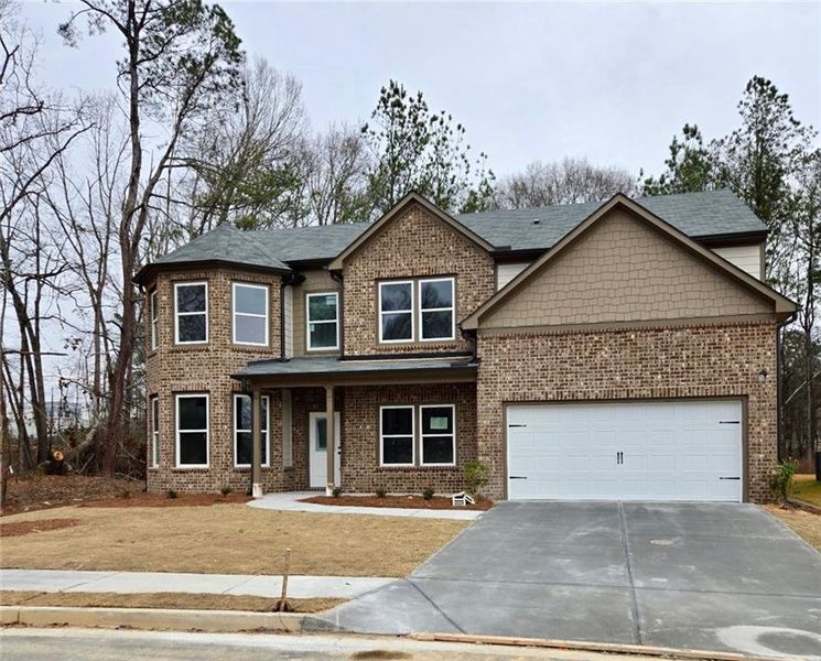 Front exterior of a new home in , Buford, GA, highlighting curb appeal (Image 1). Front exterior of a new home in , Buford, GA, highlighting curb appeal (Image 1).