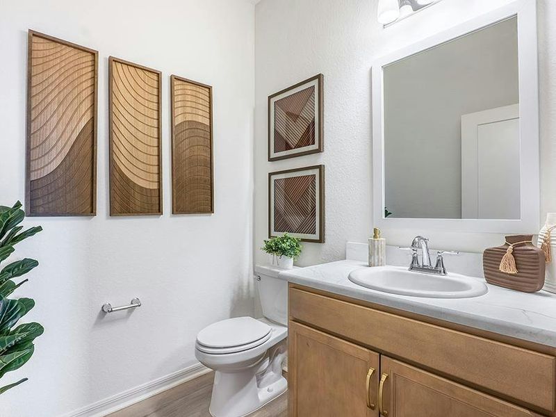 And, a convenient powder room is located near your main living area - Monroe by Highland Homes