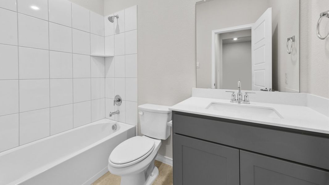 Representative furnished interior of a home built from the Bastrop by D.R. Horton in Woodcreek, Fate (Image 4).