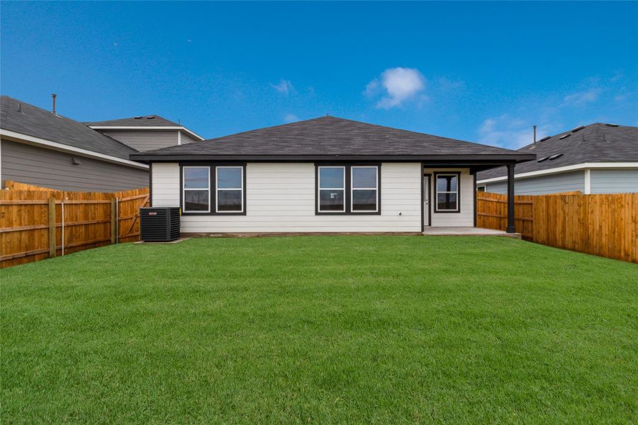 Front exterior of a new home in Monarch Ranch, Manor, TX, highlighting curb appeal (Image 22). Front exterior of a new home in Monarch Ranch, Manor, TX, highlighting curb appeal (Image 22).