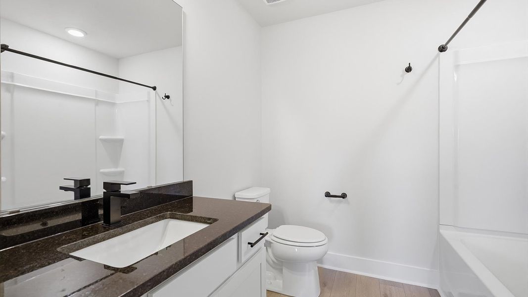 Secondary bathroom designed with a luxurious feel and practical functionality by DRB Homes