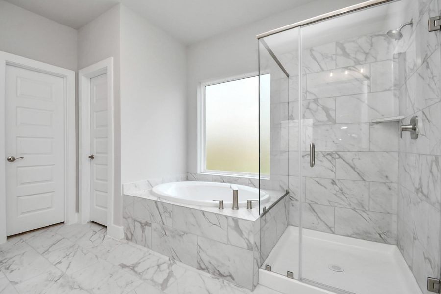 Enjoy a walk-in shower with tasteful tile surround. Ultimate relaxation after a long day. Sample photo of completed home with similar floor plan. Actual colors and selections may vary. Enjoy a walk-in shower with tasteful tile surround. Ultimate relaxation after a long day. Sample photo of completed home with similar floor plan. Actual colors and selections may vary.