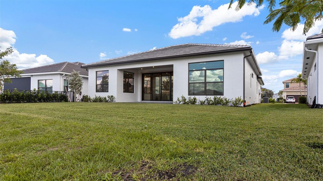 Exterior details and patio area of a home in Cresswind Palm Beach at Westlake, Westlake (Image 3). Exterior details and patio area of a home in Cresswind Palm Beach at Westlake, Westlake (Image 3).