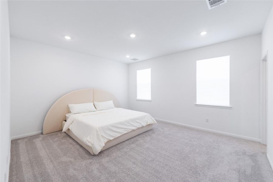 Bedroom with carpet flooring and recessed lighting