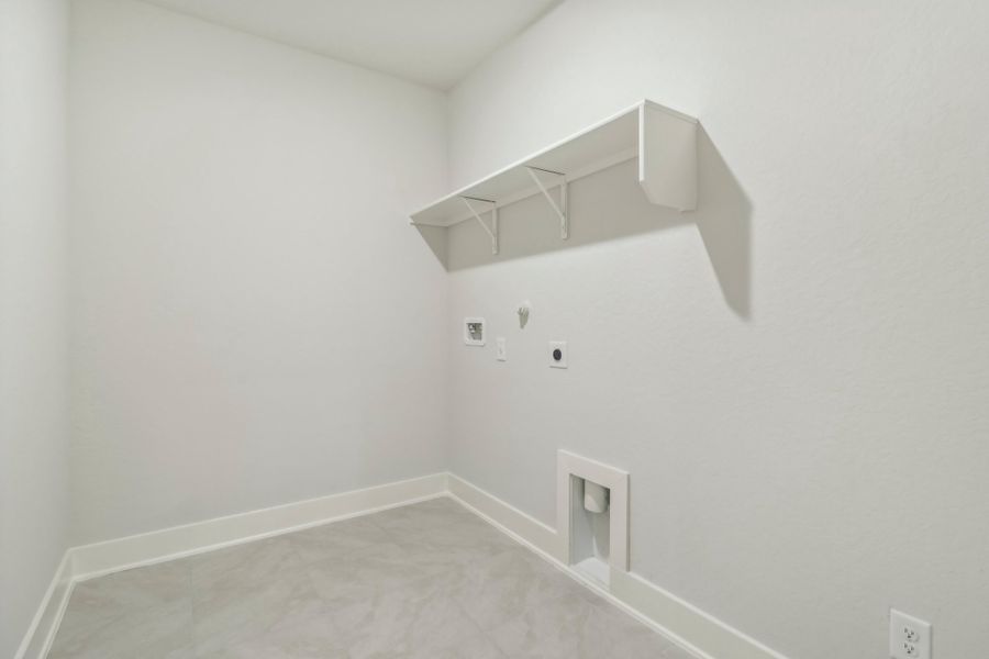 Laundry room in the Hughes floorplan at a Meritage Homes community.