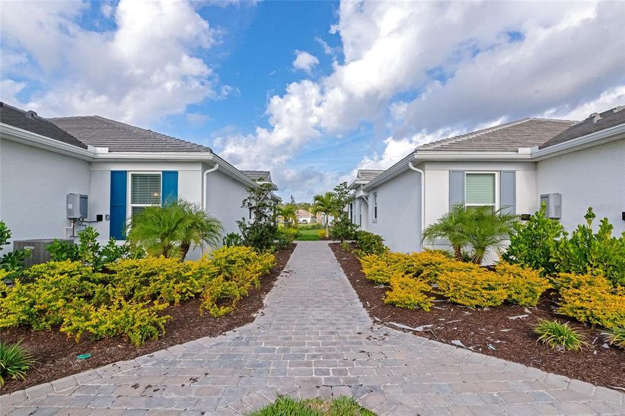 Front exterior of a new home in , Sarasota, FL, highlighting curb appeal (Image 24).
