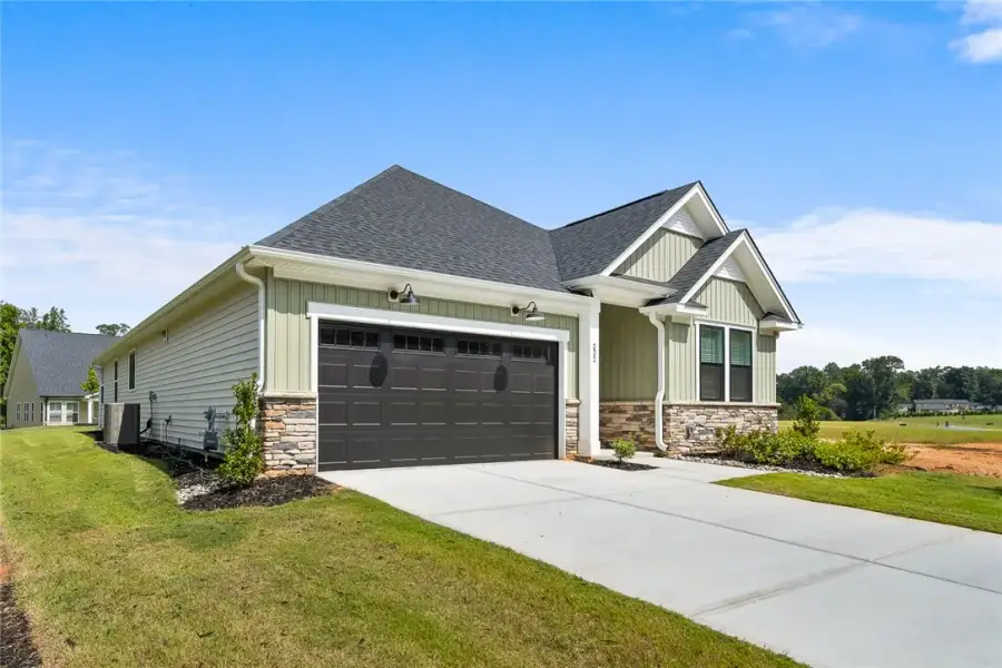 Front exterior of a new home in Saratoga Oaks, Williamston, SC, highlighting curb appeal (Image 2). Front exterior of a new home in Saratoga Oaks, Williamston, SC, highlighting curb appeal (Image 2).