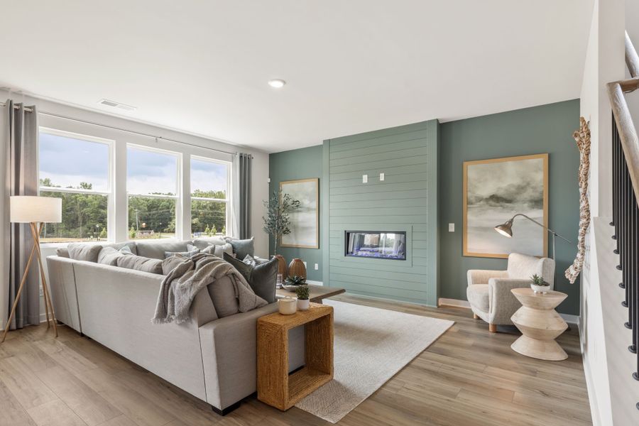 A living room with a couch and a table. A living room with a couch and a table.