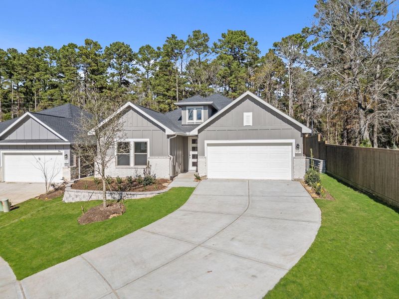 Front exterior of a new home in , Conroe, TX, highlighting curb appeal (Image 23).