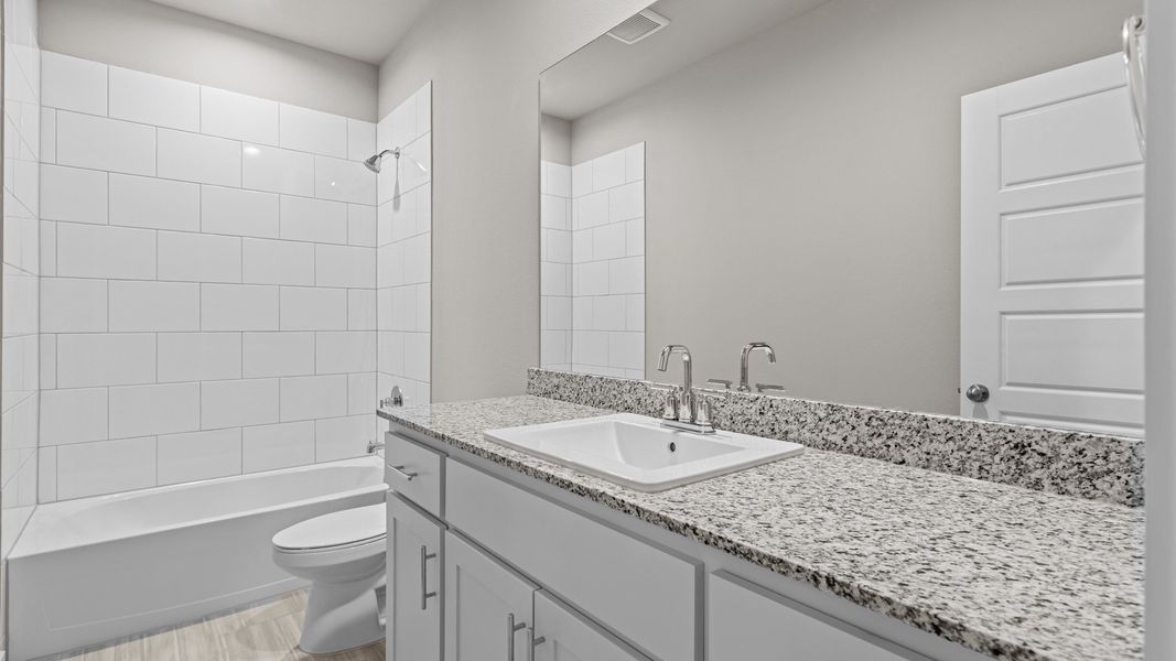 Representative furnished interior of a home built from the Jaxson by D.R. Horton in Legacy South, Midland (Image 10).