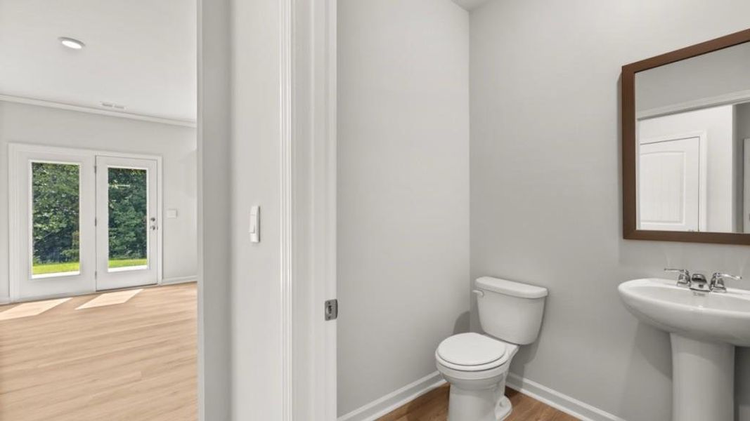 Furnished interior view inside a new home in Northwoods at Mirror Lake, Villa Rica (Image 6).