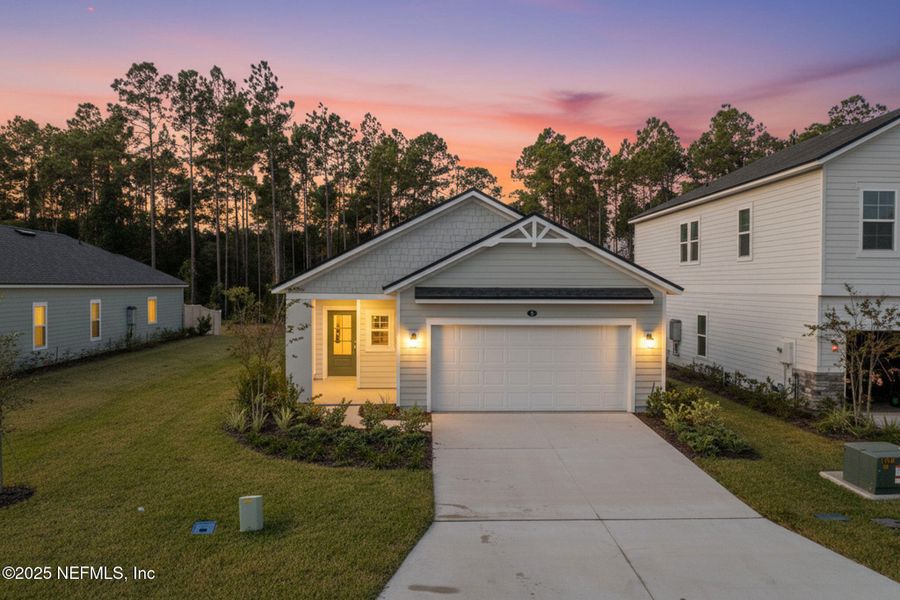 Front exterior of a new home in Beacon Lake, St. Augustine, FL, highlighting curb appeal (Image 2).
