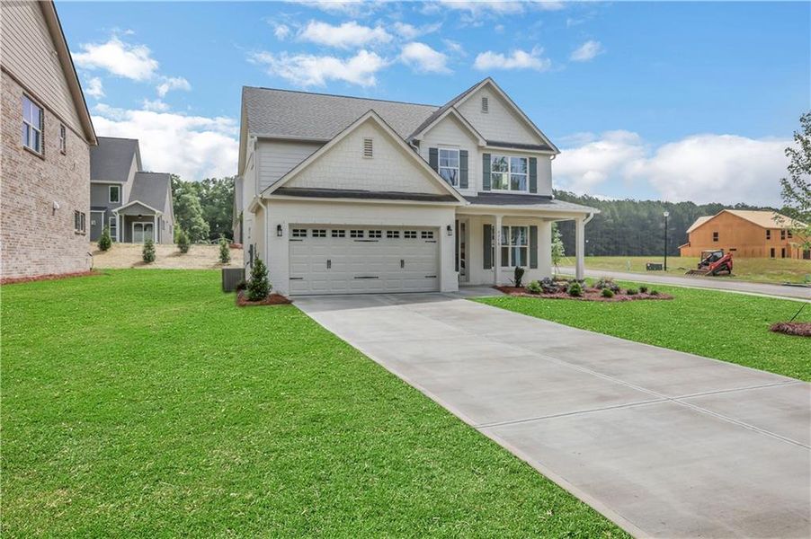 Front exterior of a new home in , Loganville, GA, highlighting curb appeal (Image 24).
