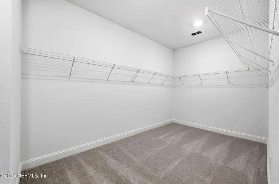 Spacious, unfurnished interior of a new home in Edenbrooke at Hyland Trail | 55+: Edenbrooke at Hyland Trail 60s, Green Cove Springs (Image 19). Spacious, unfurnished interior of a new home in Edenbrooke at Hyland Trail | 55+: Edenbrooke at Hyland Trail 60s, Green Cove Springs (Image 19).