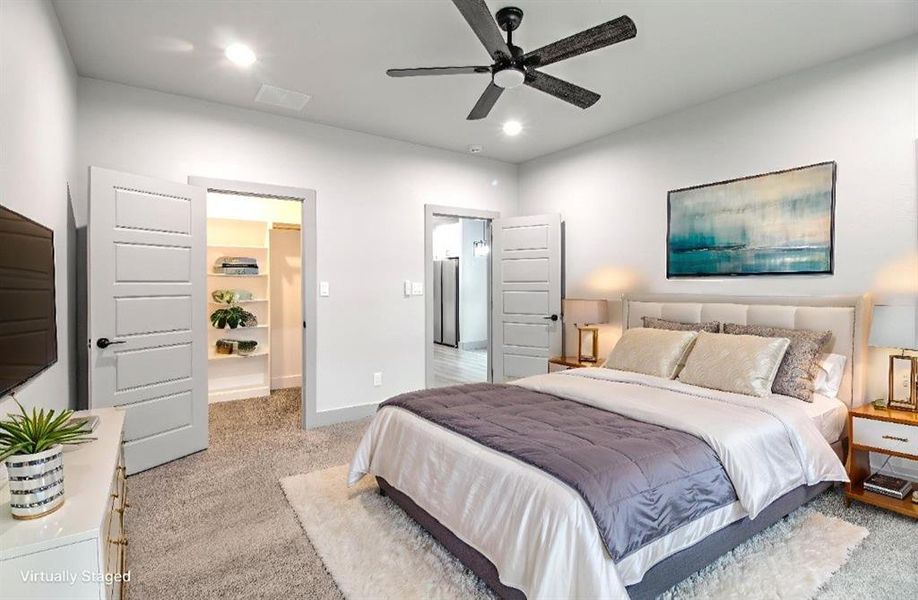 Bedroom with light colored carpet, recessed lighting, and ceiling fan Bedroom with light colored carpet, recessed lighting, and ceiling fan