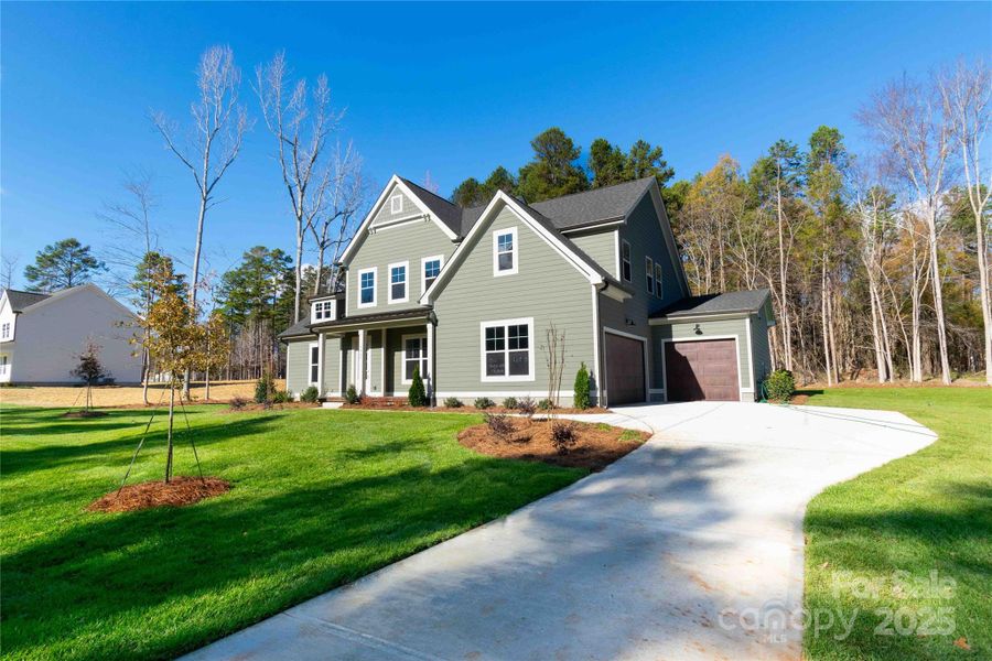 Front exterior of a new home in , Matthews, NC, highlighting curb appeal (Image 16).
