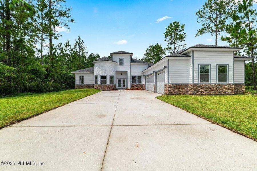 Front exterior of a new home in , Jacksonville, FL, highlighting curb appeal (Image 22).