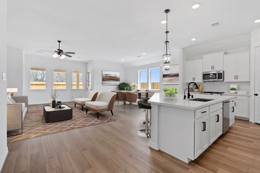 Open concept living space. Note: Sample product photo. Actual exterior and interior selections may vary by homesite. Photo may be virtually staged