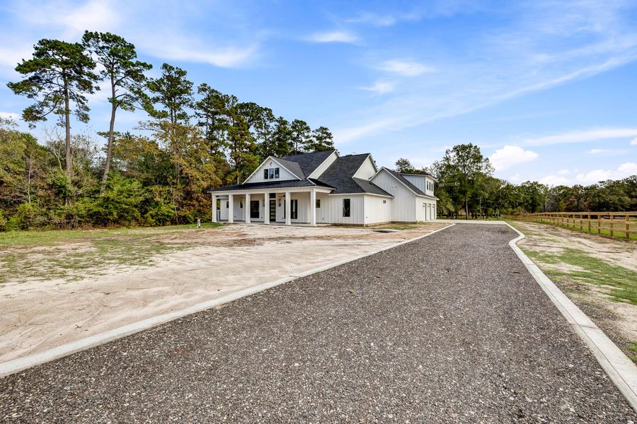 Front exterior of a new home in , Magnolia, TX, highlighting curb appeal (Image 2). Front exterior of a new home in , Magnolia, TX, highlighting curb appeal (Image 2).