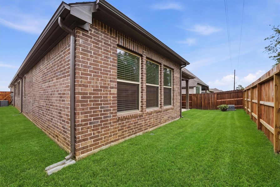 Exterior details and patio area of a home in , Magnolia (Image 25).