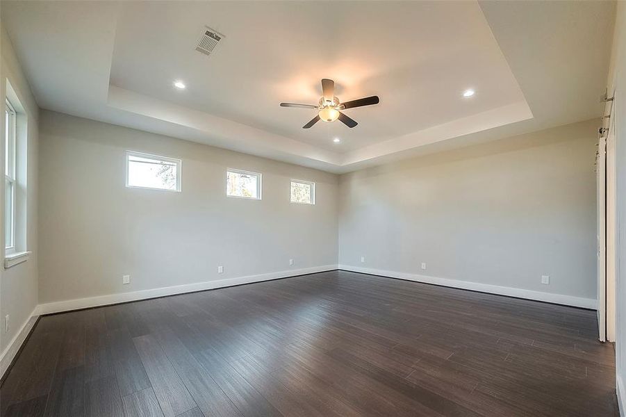 Primary bedroom with vaulted ceilings