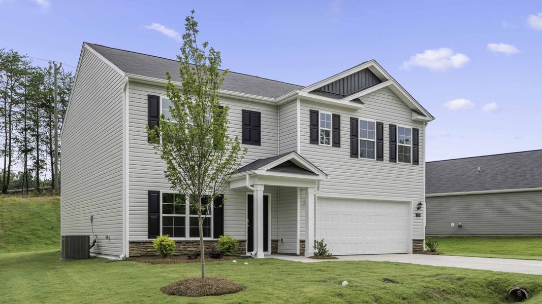 Front exterior of a new home in Greystone North, Stoneville, NC, highlighting curb appeal (Image 2). Front exterior of a new home in Greystone North, Stoneville, NC, highlighting curb appeal (Image 2).