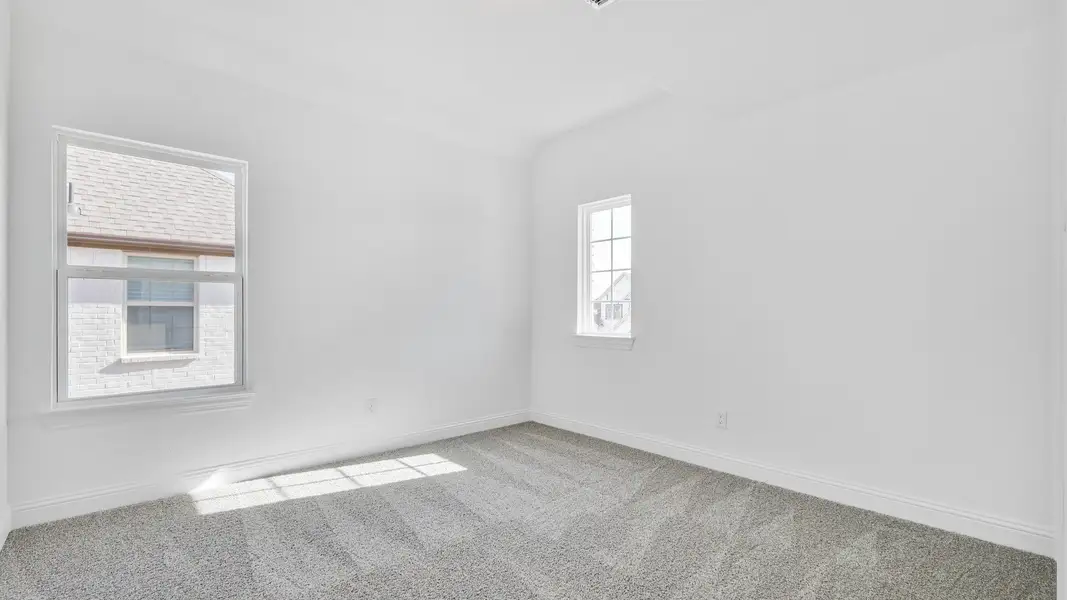 Representative furnished interior of a home built from the Stanford by DRB Homes in Creekhaven, Iowa Colony (Image 17).