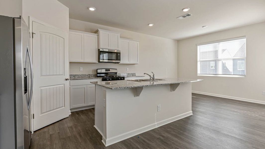 Representative furnished interior of a home built from the Darwin by D.R. Horton in Sherwood Manor, College Park (Image 4).