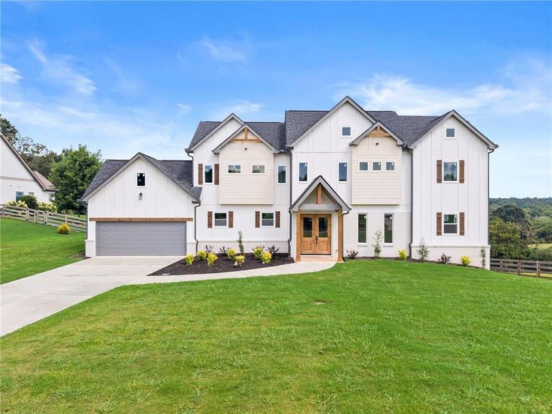 Front exterior of a new home in , Clermont, GA, highlighting curb appeal (Image 30).