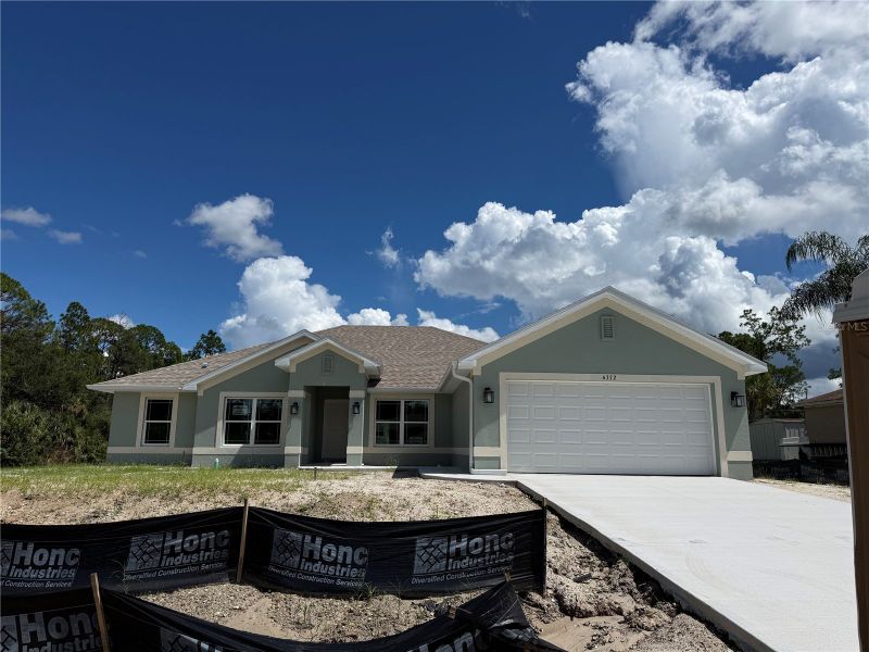 Front exterior of a new home in North Port, North Port, FL, highlighting curb appeal (Image 1). Front exterior of a new home in North Port, North Port, FL, highlighting curb appeal (Image 1).