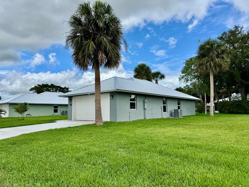 Front exterior of a new home in , Okeechobee, FL, highlighting curb appeal (Image 2).