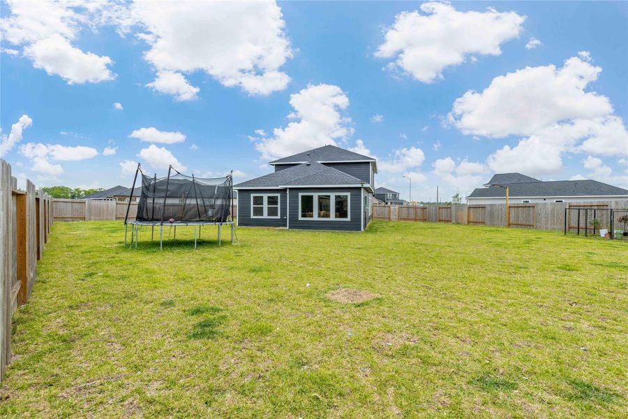 Exterior details and patio area of a home in Sweetgrass Village, Crosby (Image 30).