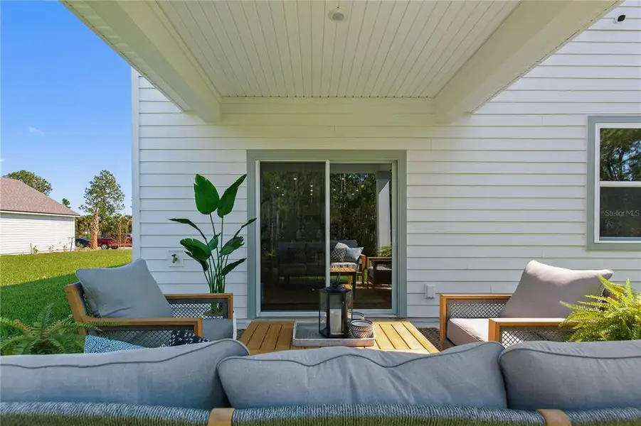 Exterior details and patio area of a home in Magnolia Series at Seminole Palms, Palm Coast (Image 4).