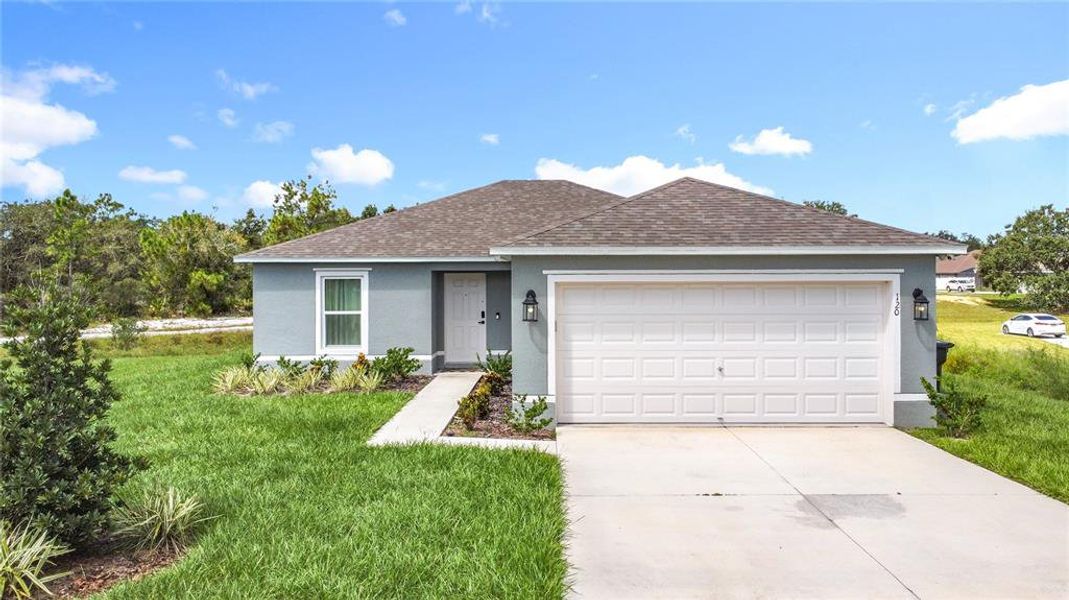 Front exterior of a new home in , Kissimmee, FL, highlighting curb appeal (Image 25). Front exterior of a new home in , Kissimmee, FL, highlighting curb appeal (Image 25).