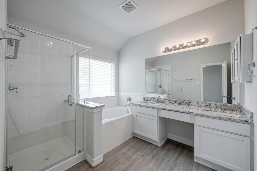 Primary bath with double sinks, & separate tub/shower