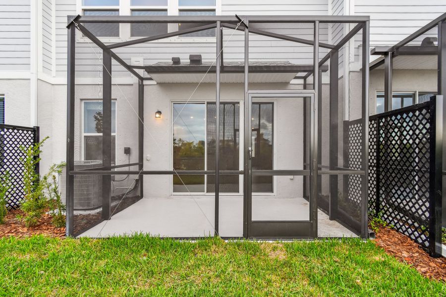 Exterior details and patio area of a home in North River Ranch – Townhomes, Parrish (Image 29). Exterior details and patio area of a home in North River Ranch – Townhomes, Parrish (Image 29).