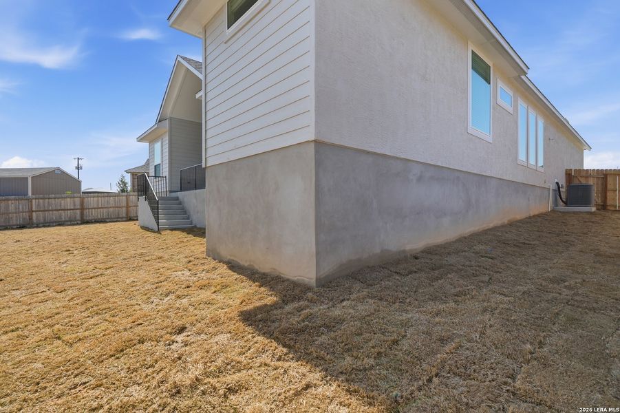 Exterior details and patio area of a home in Potranco Oaks, Castroville (Image 29).