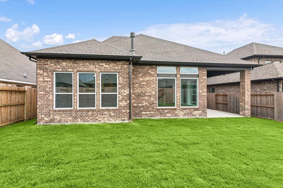 Front exterior of a new home in Riceland 50’ Front Load Homesites, Mont Belvieu, TX, highlighting curb appeal (Image 1). Front exterior of a new home in Riceland 50’ Front Load Homesites, Mont Belvieu, TX, highlighting curb appeal (Image 1).