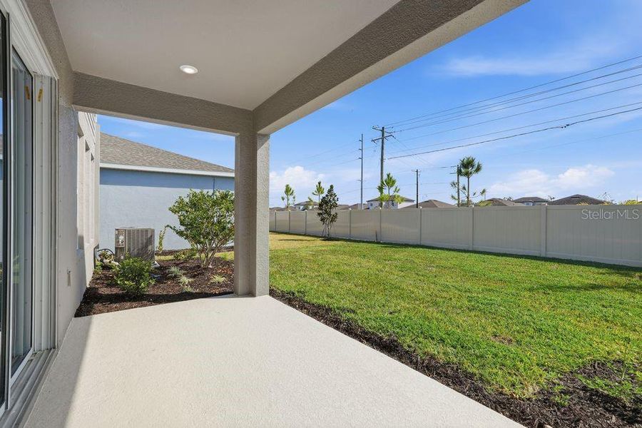 Exterior details and patio area of a home in Indigo Creek, Apollo Beach (Image 30).