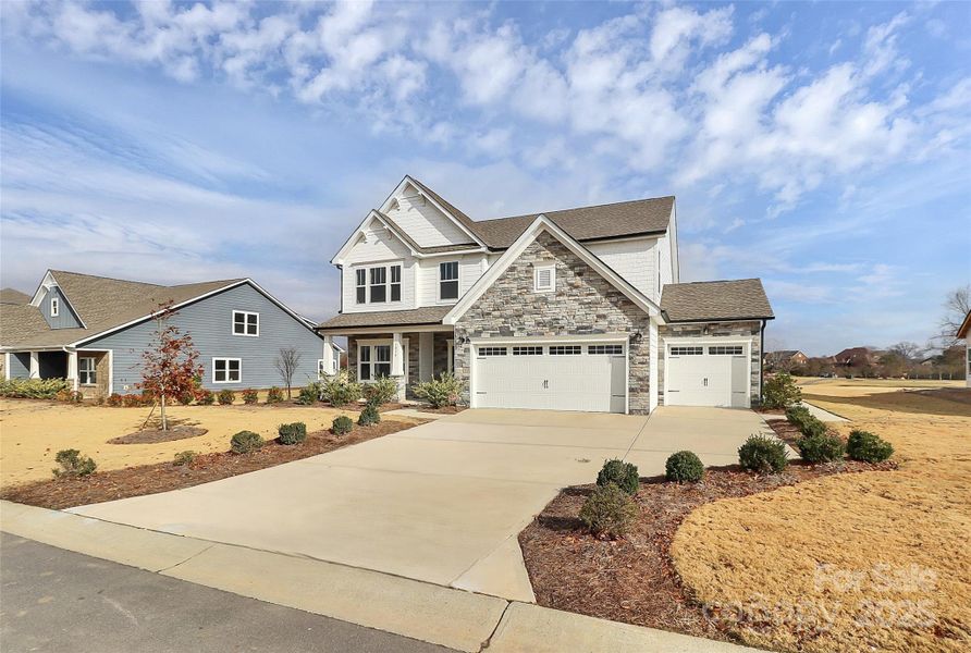 Front exterior of a new home in Stonebridge Fairways, Monroe, NC, highlighting curb appeal (Image 20).