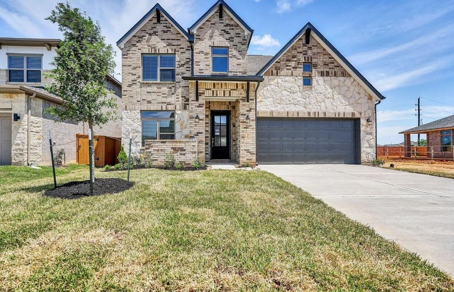 Front exterior of a new home in , Katy, TX, highlighting curb appeal (Image 1). Front exterior of a new home in , Katy, TX, highlighting curb appeal (Image 1).