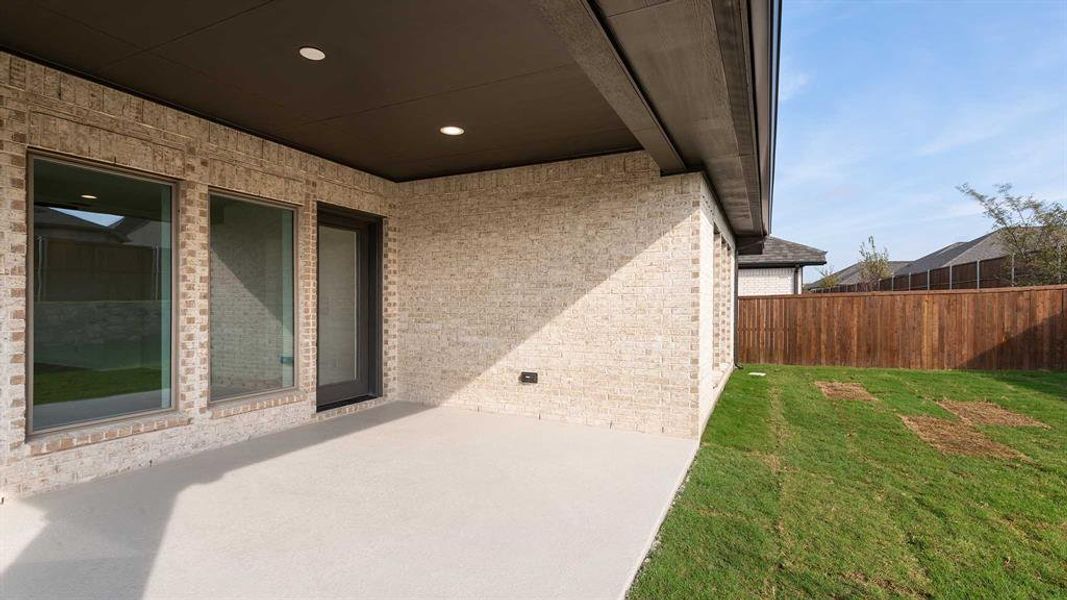 Exterior details and patio area of a home in Devonshire - Reserve 45', Forney (Image 3). Exterior details and patio area of a home in Devonshire - Reserve 45', Forney (Image 3).