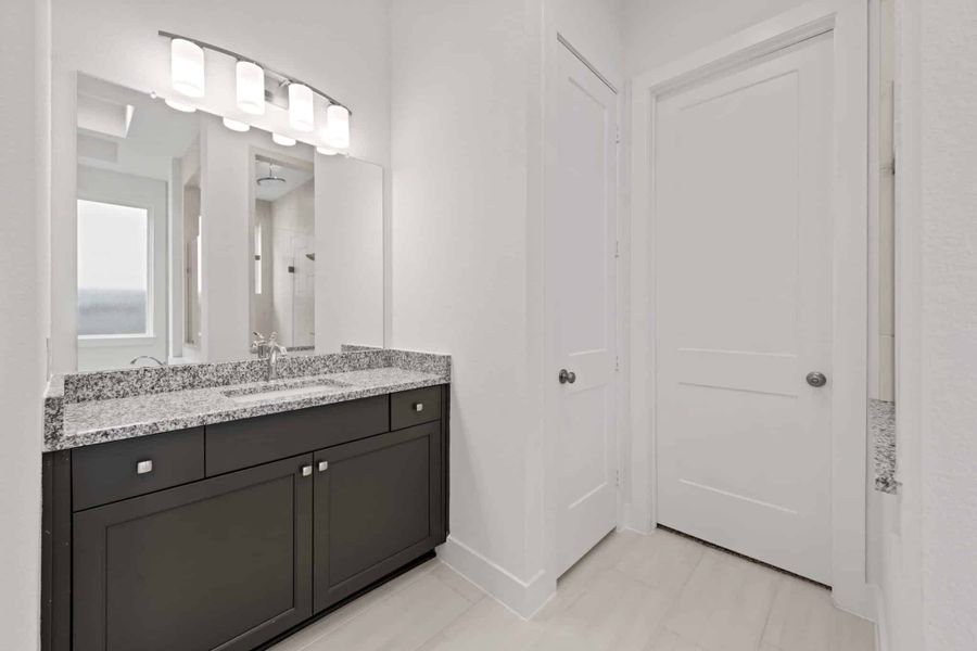 Representative furnished interior of a home built from the Rivers 60′ Lot by Chesmar Homes in Fulshear Lakes, Fulshear (Image 12).